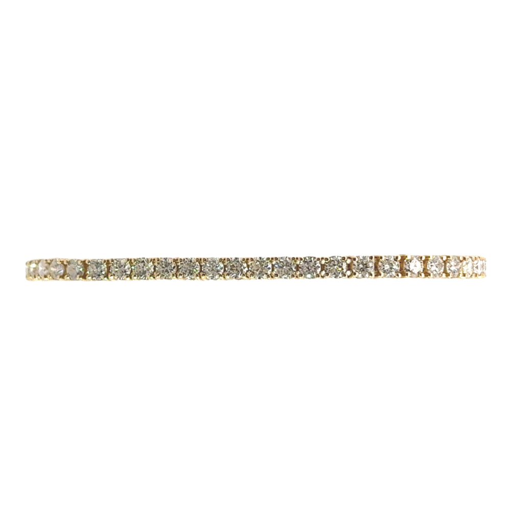14 karaat geel gouden tennisarmband van 10 gram. Bezet met 52 briljant geslepen diamanten met een totaalgewicht van 7.04 crt. Kleur: G Kwaliteit: SI1 Lengte: 19 cm Breedte: 4 mm Dikte: 3 mm