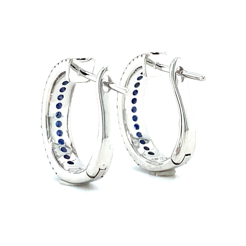 
                      
                        18 karaats witgouden halve creool oorbellen 80 briljant geslepen diamanten 0.22crt kleur Top wesselton kwaliteit vs2 en 28 saffieren 0.31crt 15x4mm model o3837
                      
                    