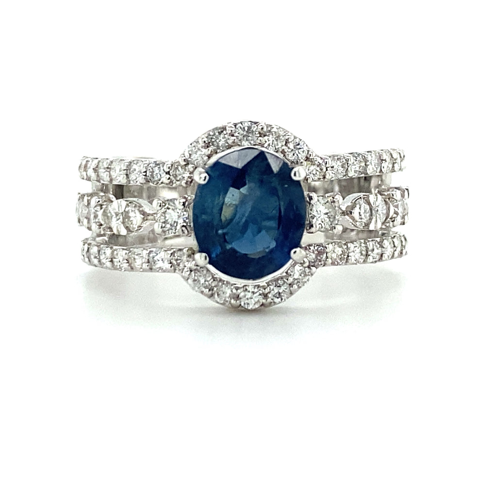 extravagante 18krt fantasie ring met 58 briljant geslepen diamanten met een totaalgewicht van 1.01 crt kleur h kwaliteit si en 1 saffier van 2.13crt maat 17/53 €1950